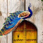 Load image into Gallery viewer, Close-up detail of Royal Peacock Doorway showing peacock plumage on plank wood