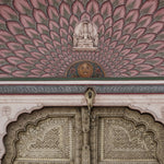 Load image into Gallery viewer, Close-up detail showing the pink lotus petal fan, painted sun face and carved brass door panels
