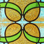 Load image into Gallery viewer, Close-up detail of Victorian Amber Scroll showing the leaded quatrefoil centre