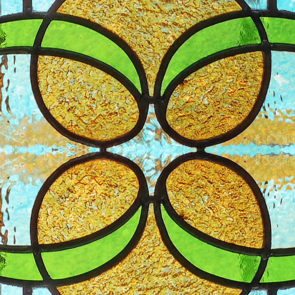 Close-up detail of Victorian Amber Scroll showing the leaded quatrefoil centre