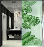 Load image into Gallery viewer, Tropical monstera leaf glass film on a window — Lolli &amp; Omi