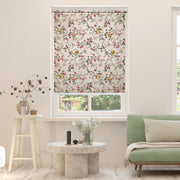 Tropical blackout window blind with blue and gold macaws flying among pink blossom branches on an antique ivory ground - Lolli & Omi