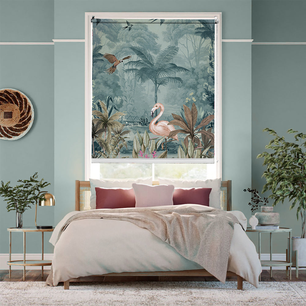 Tropical blackout window blind with a pink flamingo in a misty teal jungle framed by large foreground leaves - Lolli & Omi