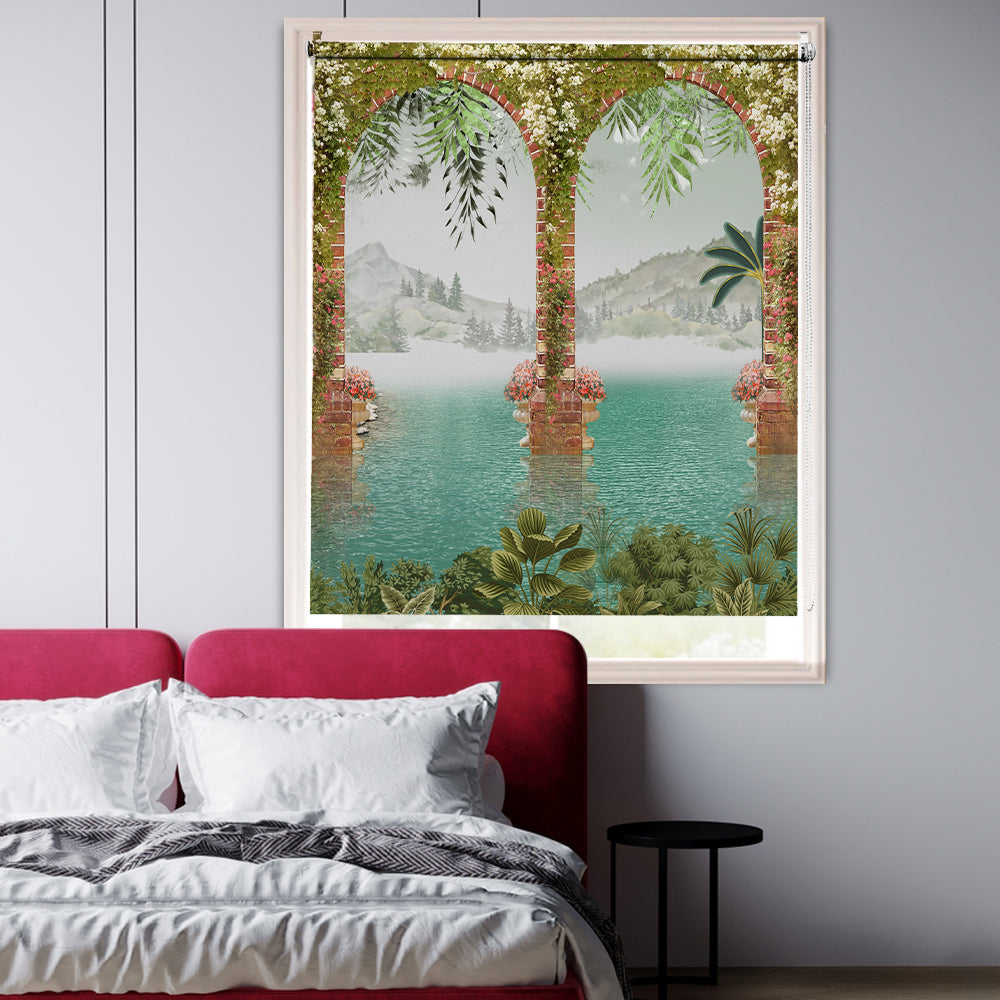 3D blackout window blind with blossom-covered brick arches opening onto a turquoise lake and misty green mountains - Lolli & Omi